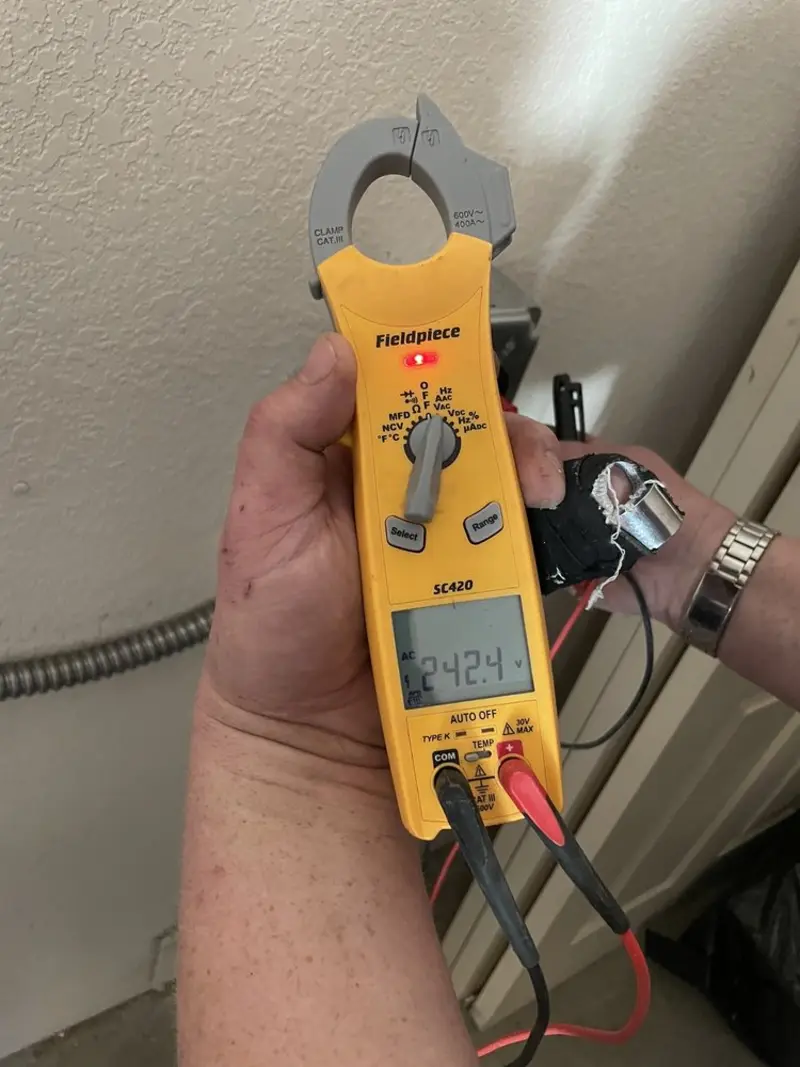 Voltage testing with clamp meter during Generator Installation in Oak Park